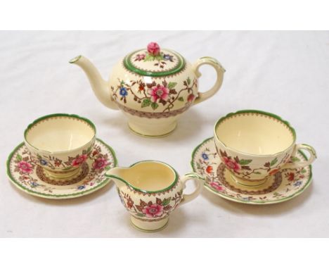 'ROYAL CAULDON' BACHELOR TEA SETwith floral decoration, comprising teapot; cup and saucer; small plate; sugar basin and milk 