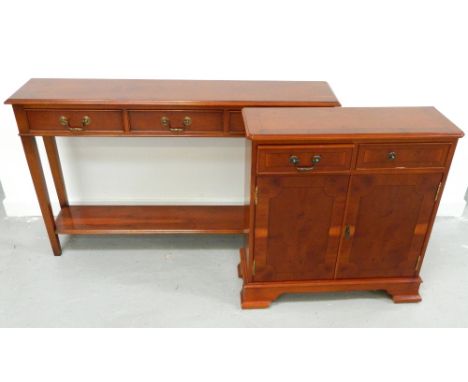 YEW CONSOLE TABLEwith a moulded top above three frieze drawers, standing on tapering supports united by an undertier, 131cm w