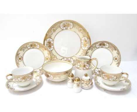 NORITAKE TEA SETdecorated with gilt highlights over a yellow ground, comprising twelve tea cups and saucers, twelve side plat