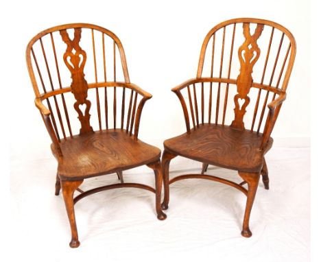 PAIR OF ELM WINDSOR ARMCHAIRS with a shaped stick back and central splat, above crinoline arms, standing on front cabriole su