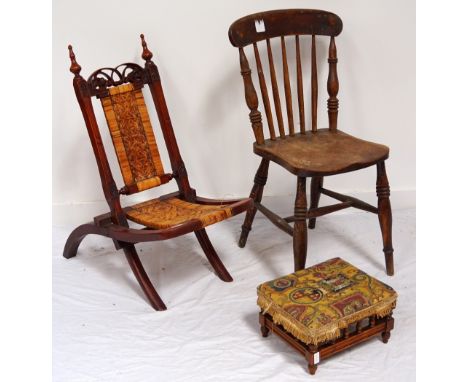 19th CENTURY STAINED PINE FOLDING CHAIRwith a shaped carved and pierced top rail flanked by a pair of finials above a woven c