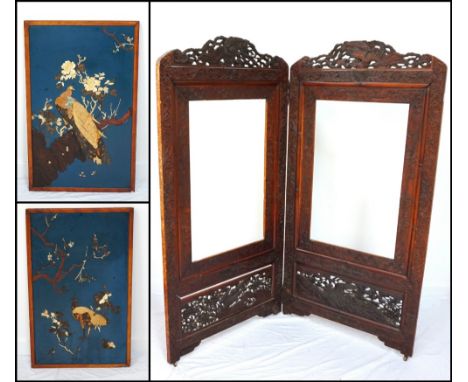 JAPANESE HEAVILY CARVED HARDWOOD FOLDING DRESSING SCREENcirca 1900, decorated throughout with exotic birds, flowers and folia