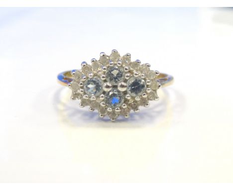 AQUAMARINE AND DIAMOND CLUSTER DRESS RINGon nine carat gold shank, the diamonds totalling approximately 0.25cts, ring size R