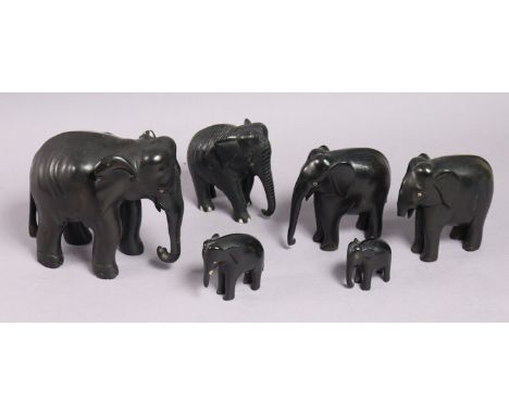 Six carved ebony graduated elephant ornaments; four die-cast scale model vehicles; &amp; a Dunlop “Kitchen Army”.