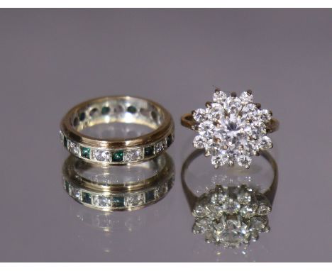 A yellow metal eternity ring set alternate green &amp; white stones, size: K (3.2gm); &amp; a 9ct. gold ring set cluster of w