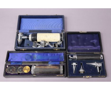 A vintage Anumbra ophthalmoscope; &amp; two vintage Gowlland ophthalmoscopes, all cased. 