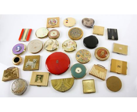 Collection of vintage compacts various sizes and shapes, including British examples, one the lid decorated with a Terrier, an