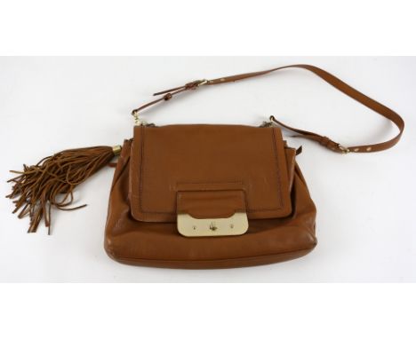Vintage Diane Von Furstenberg tan leather shoulder bag with tassel.    