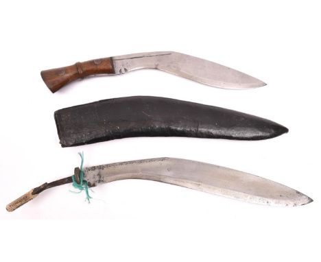 A kukri, the blade stamped with a broad arrow and "INDIA", with rivetted wood grips, no sheath; and another kukri in leather 
