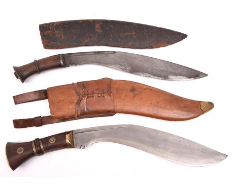 A kukri, the blade spuriously marked with broad arrow over "I", "1917", etc, in its leather covered sheath; and another kukri