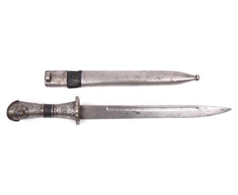 A Tibetan dagger, blade 11½" with narrow fullers, pierced and engraved steel guard and coral stud, in its rather crude plain 