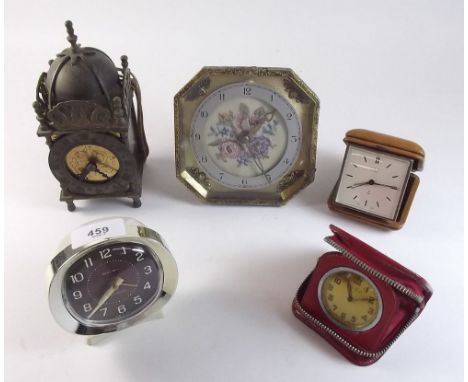 An Oris travel alarm clock, travel clock, a Smiths sectric lantern clock and two other clocks