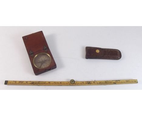 A small 19th century wooden cased compass and a pocket folding rule