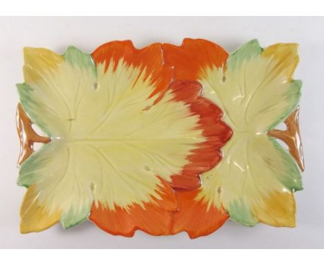 A Clarice Cliff leaf form cake plate - hairline crack