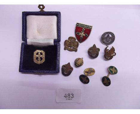 A group of scouting badges including two silver ones plus a pair of cufflinks and a girl guide badge