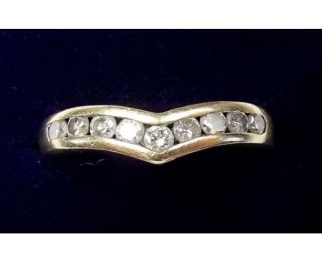 An 18 carat gold and diamond set wishbone ring - size R