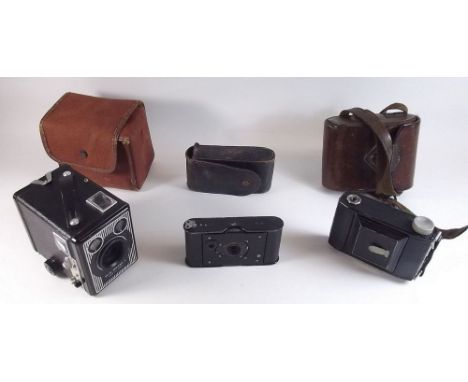 A Vest Pocket Kodak, a Brownie box camera and a Monte Carlo camera - all cased