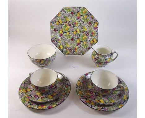 A Crown Ducal tea service printed fruits comprising six cups and saucers, six tea plates, cake plate, milk and sugar