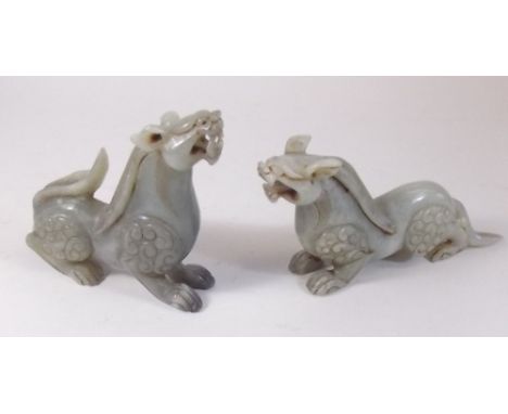 A pair of mid 20th century carved 'jade' dragons