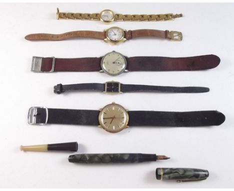 A Timex vintage gents wrist watch, Solix watch and three ladies watches, plus ink pen and cigarette holder