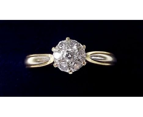 An 18 carat gold diamond set cluster ring - size R 1/2