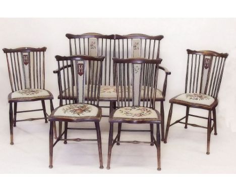 An Edwardian stick back salon suite with two seater settee and five side chairs upholstered in floral tapestry