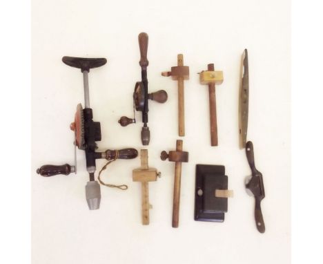 A box of woodworking tools including Stanley breast brace, four marking gauges, level, spoke shave etc