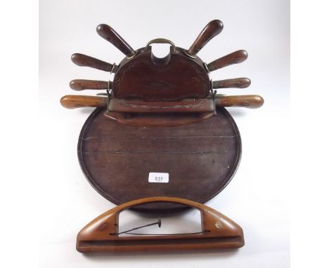 An Indian carved wooden carving set together with a circular wooden tray and a weaving tool