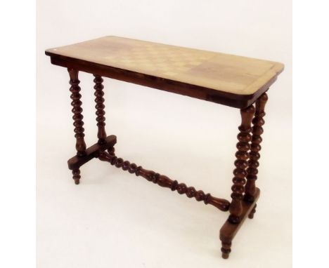 A Victorian stretcher table with inlaid chessboard top and bobbin turned supports