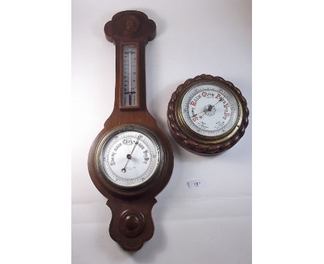 A Negretti and Zambra barometer/thermometer and another circular barometer with rope twist surround