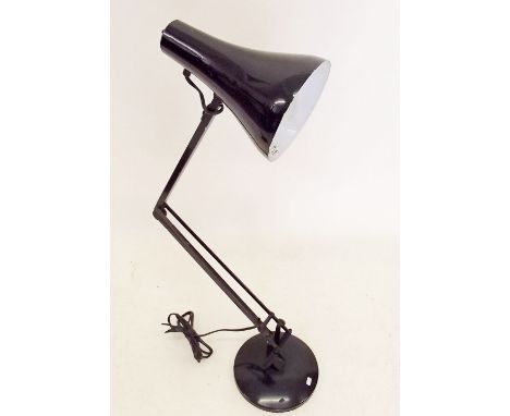 A vintage black anglepoise lamp