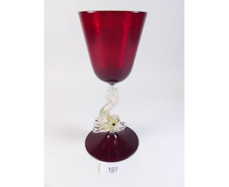 A vintage Murano Salviati ruby and gold glass goblet with dolphin stem - 21cm