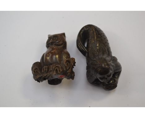 A Japanese dark wood Netsuke depicting an owl sat on a thick branch or log, superb patina, in excellent condition and signed 