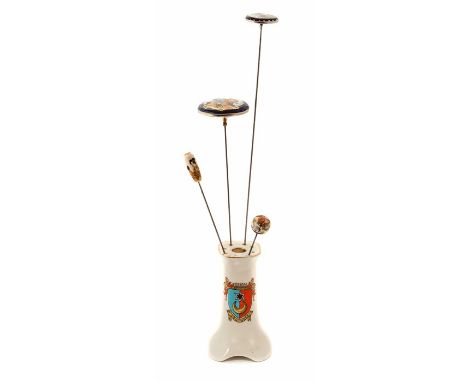 Four Japanese Satsuma ware hat pins in a Crested ware china stand (5)