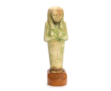An Egyptian Faience ShabtiAn ancient Egyptian faience shabti figure from the Third Intermediate period, C. 930-745 BC. Formed