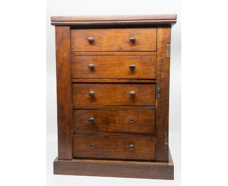A set of bellows, a vintage mirror and a small tabletop chest of drawers