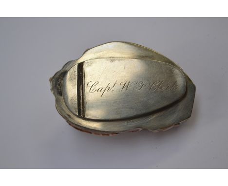 A brass single draw telescope with black leather cover along with a snuff box in the form of a shell; named to "Captain WF Cl