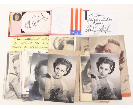 A collection of various portrait postcards, some bearing printed autographs to the front, together with a small autograph boo