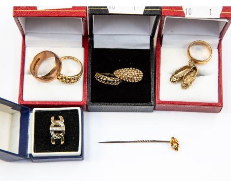 A collection of size 9ct gold rings, comprising two granular design rings, a plain band with a combined total gross weight ap