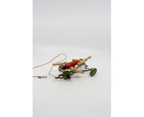 Vintage pull along swimming figure and an acrobat toy. Wood and metal.