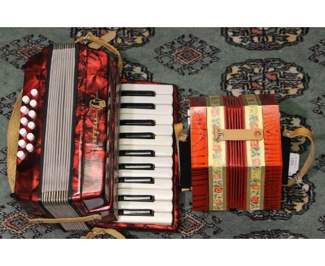 A vintage German made 20 button key concertina, by Bandmaster, in its original box along with a German mini accordion (3)