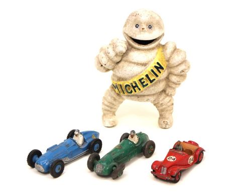 A vintage cast metal promotional Michelin Man model and three 1950's Dinky Toys sports cars