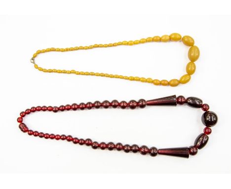 A vintage cherry coloured bead necklace, with graduated round and cone shaped beads, possibly Bakelite, length approx 24'', t