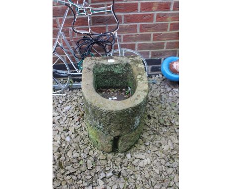 An 18th Century limestone demi lune trough.