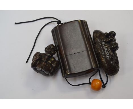 A&nbsp; lacquered Japanese Inro and Netsuke, the Inro is in excellent condition and depicts a fisherman holding a fish, the N