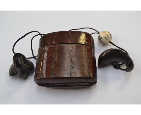 A&nbsp; Tonkotsu in dark wood with a dark wood signed Netsuke depicting a carp, the Okime is also signed, excellent all round