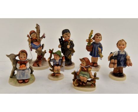 A group of seven Hummel figures including a girl with a dog and slipper, S6/B