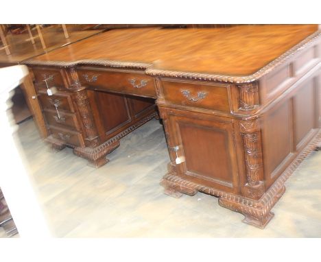 **VH - CH 30/10/19 REOFFER IN A&amp;C NOV £300-£400** A late 20th century carved mahogany pedestal desk, two short and one lo