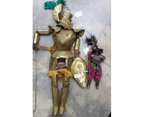 Two Continental puppet character dolls including a golden knight and Samurai warrior