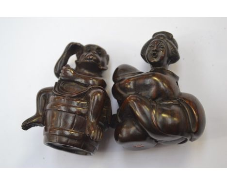 A&nbsp; Japanese dark wood Netsuke depicting a monkey sat on a barrel, in excellent condition and signed along with a Japanes